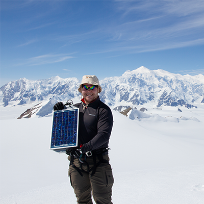 student holding a solar screen